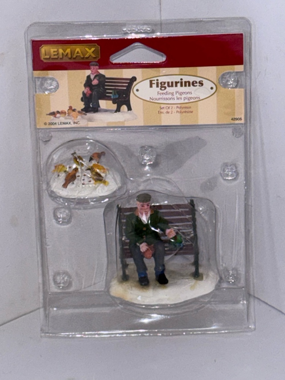 Lemax feeding pigeons Man on Brown Bench figurines